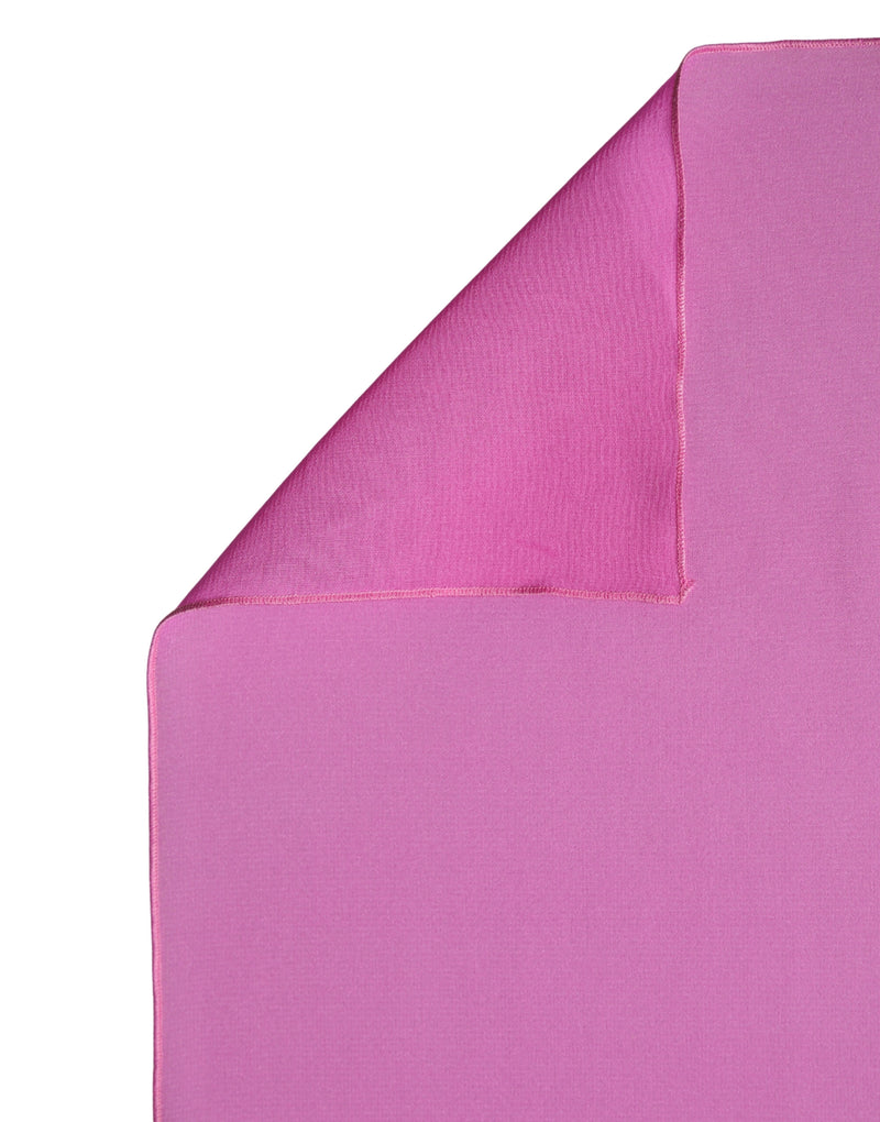 Bright pink silk shawl or scarf folded to show smooth, lightweight fabric texture