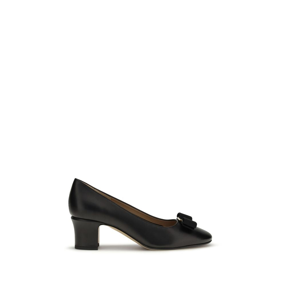 Ferragamo black calf leather mid-heel pump featuring a signature bow detail on the toe.