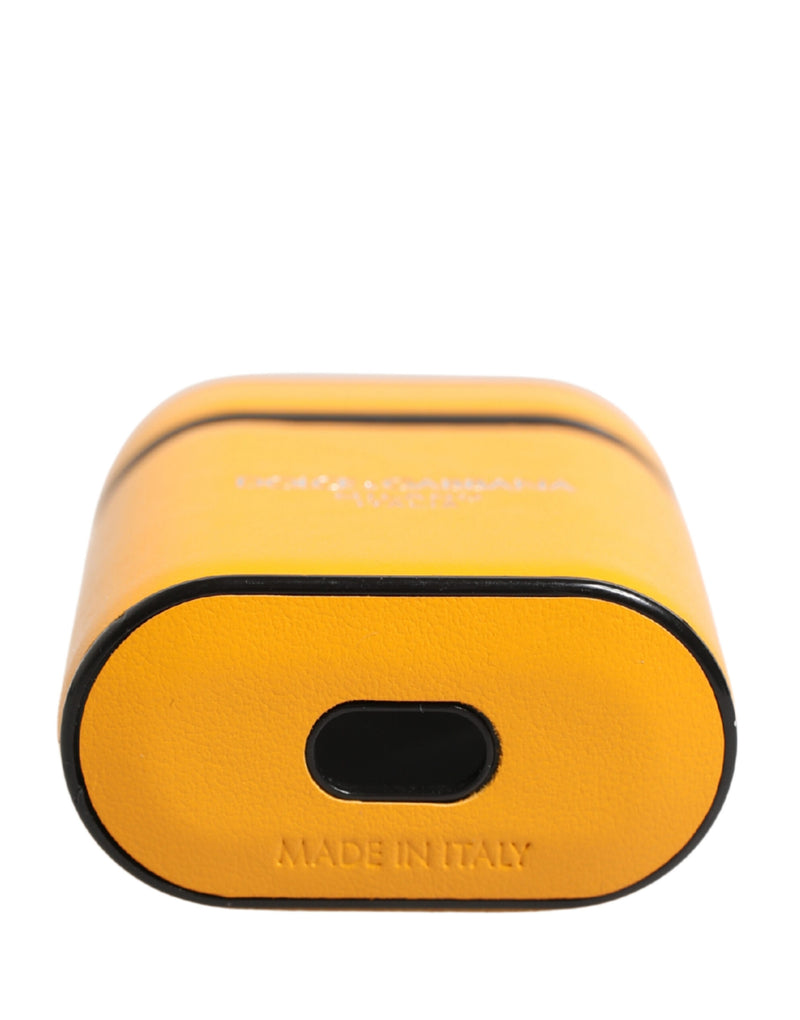 Yellow leather AirPods case with black trim and stamped branding
