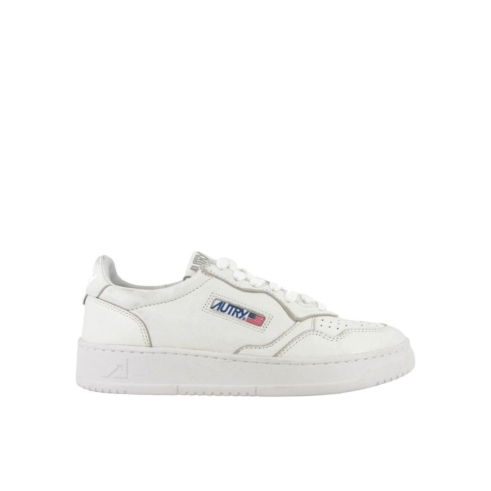 Autry white leather low-top sneakers with a perforated toe box, lace-up front, and branded side tab.