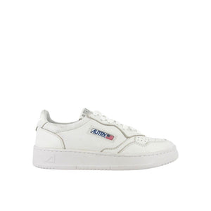 Autry white leather low-top sneakers with a perforated toe box, lace-up front, and branded side tab.