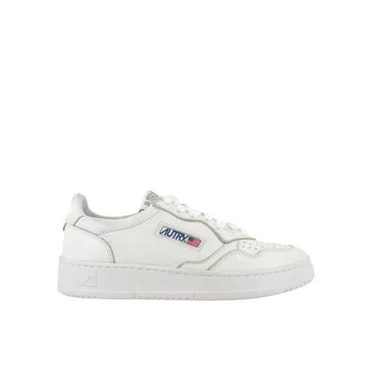 Autry white leather low-top sneakers with a perforated toe box, lace-up front, and branded side tab.