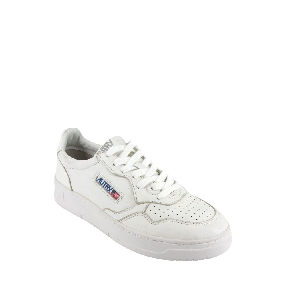 Autry low-top sneakers in white leather with a perforated toe box, white laces, and side logo patch.