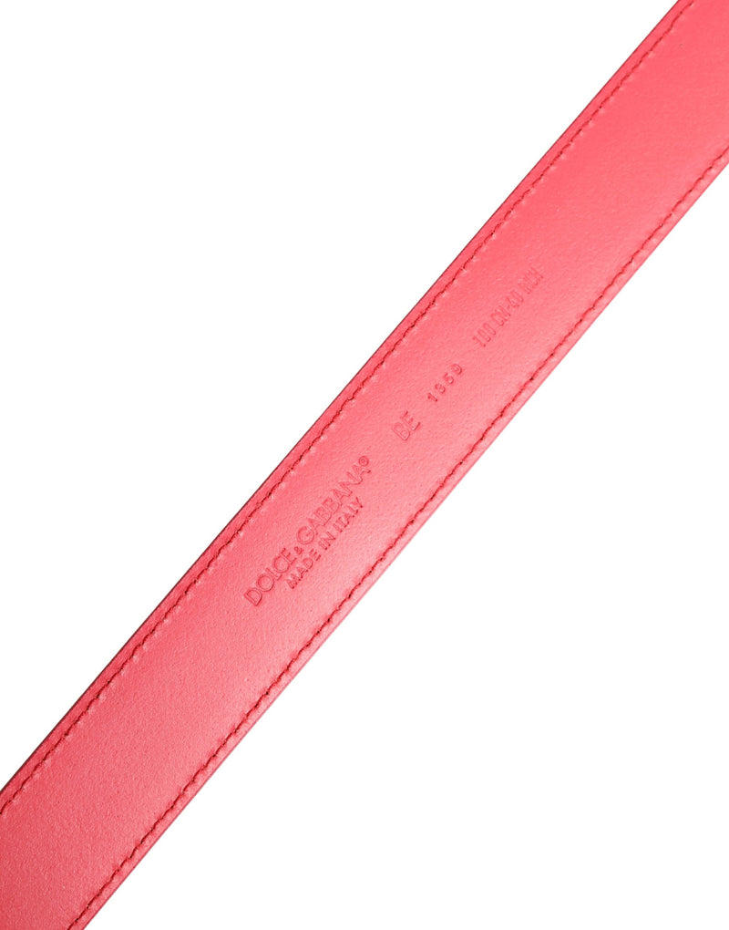 Pink leather belt with stitched edges and embossed Dolce & Gabbana branding on the inner strap