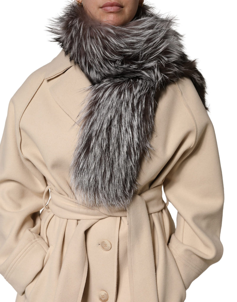 Fluffy gray and black fox fur neck wrap scarf worn over a beige coat