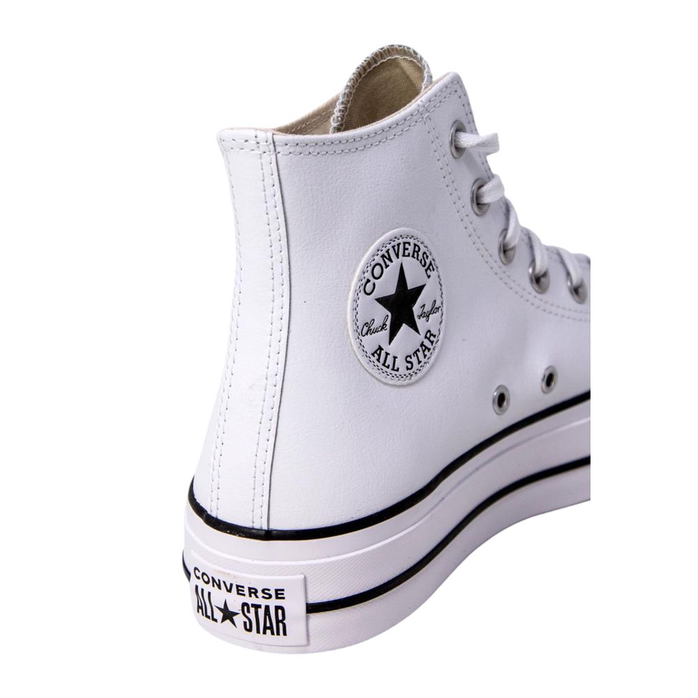 White leather Converse Chuck Taylor high-top sneaker with black details and classic side ankle patch.