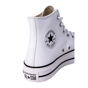 White leather Converse Chuck Taylor high-top sneaker with black details and classic side ankle patch.