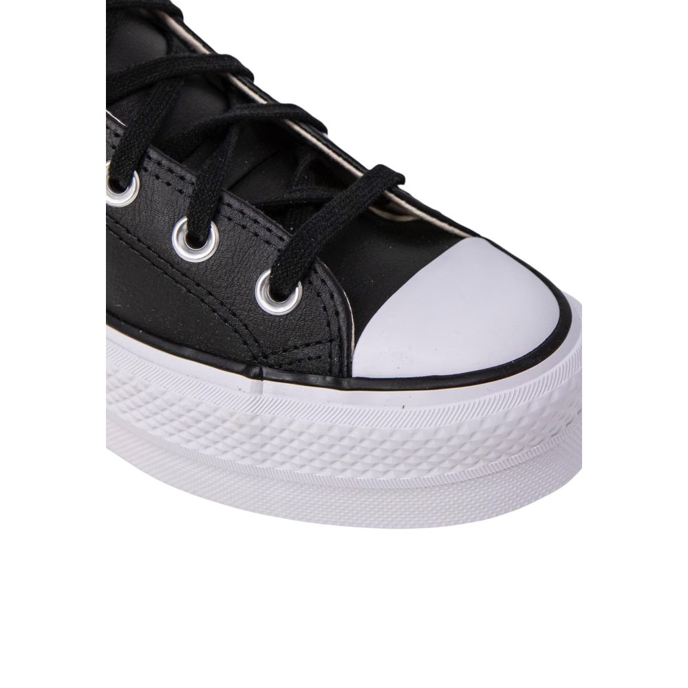 Black leather high-top sneaker with a white rubber toe cap and a chunky, textured platform sole.