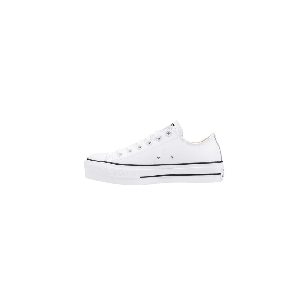 White leather Converse low-top platform sneakers with black stripe detail on a thick rubber sole.