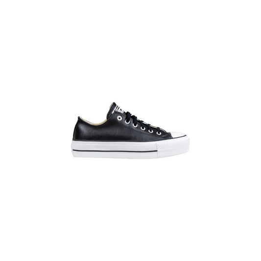 Converse low-top sneakers in black leather with matching black laces and a thick white platform sole.