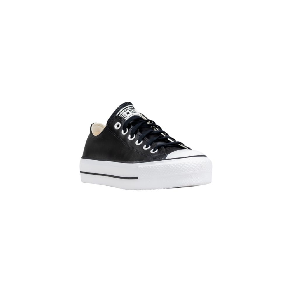 Black leather low-top Converse sneakers with a thick, white rubber platform sole and matching black laces.