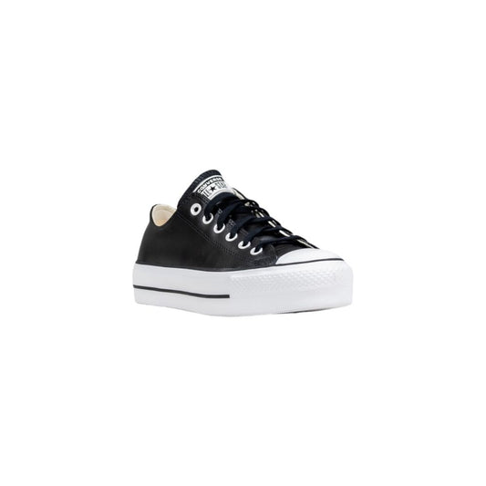 Black leather low-top Converse sneakers with a thick, white rubber platform sole and matching black laces.