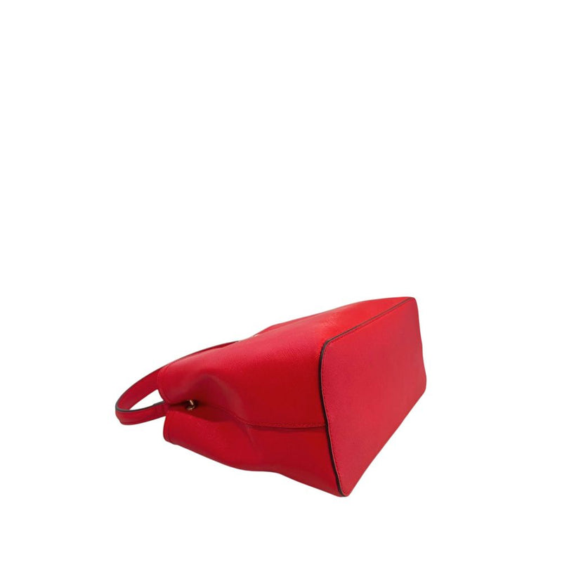 Red PU leather women handbag laid on its side