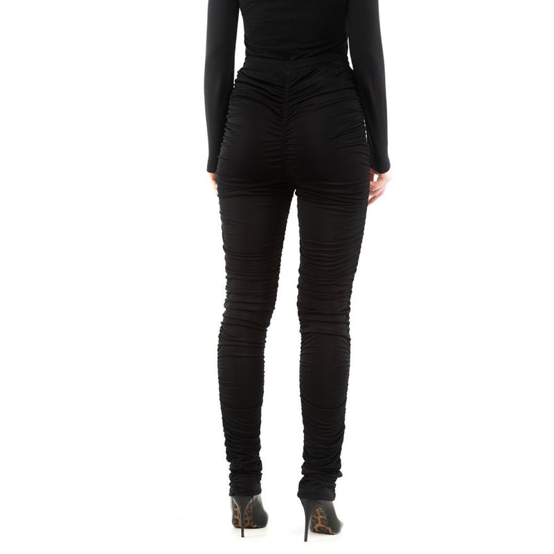Black ruched viscose casual pants worn by a model from the back