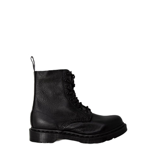Black Dr. Martens ankle boots in pebbled leather with tonal laces, matching black sole, and rear pull tab.
