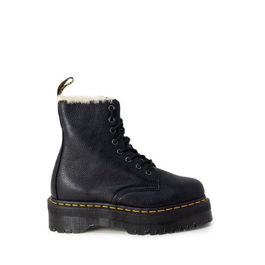 Black leather Dr. Martens lace-up platform boots with faux fur lining and signature yellow welt stitching.