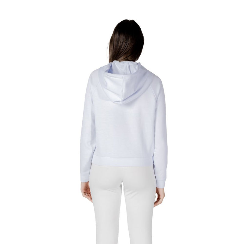 Woman wearing a white viscose hoodie from the back view
