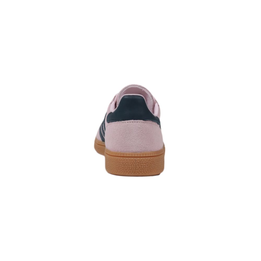 Rear view of pink nubuck leather sneaker with dark blue heel tab and textured gum rubber sole.
