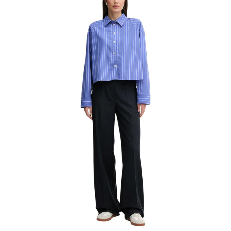 Calvin Klein Jeans blue and white striped cotton button-up blouse paired with black trousers