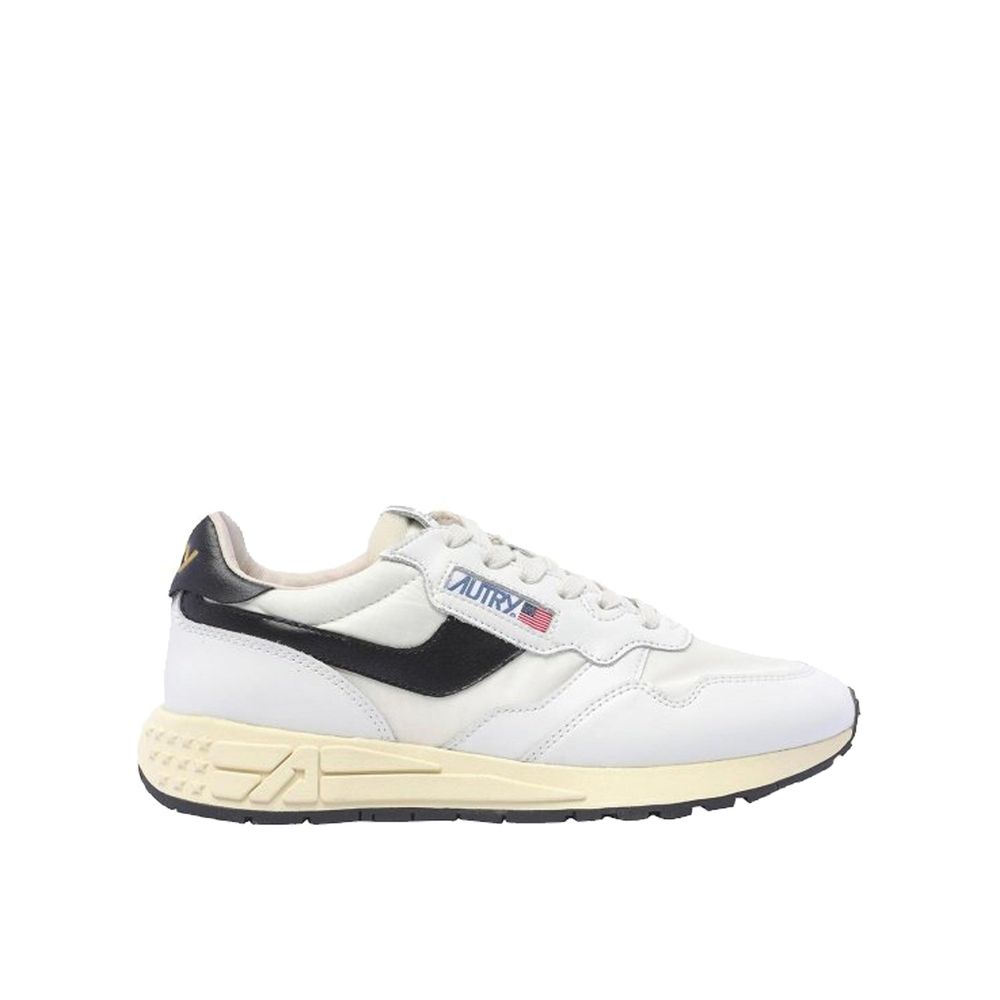Autry low-top sneakers in white leather with black accents, side logo detail, and a vintage-style cream rubber sole.