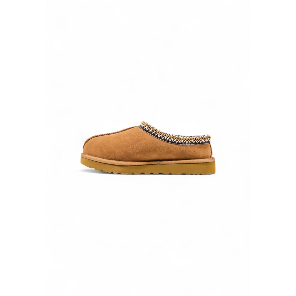UGG beige suede slipper with woven patterned collar trim and flat rubber sole.