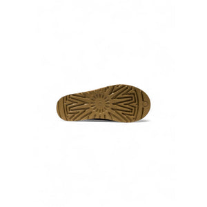 UGG beige leather ankle boot sole showing brown tread pattern.