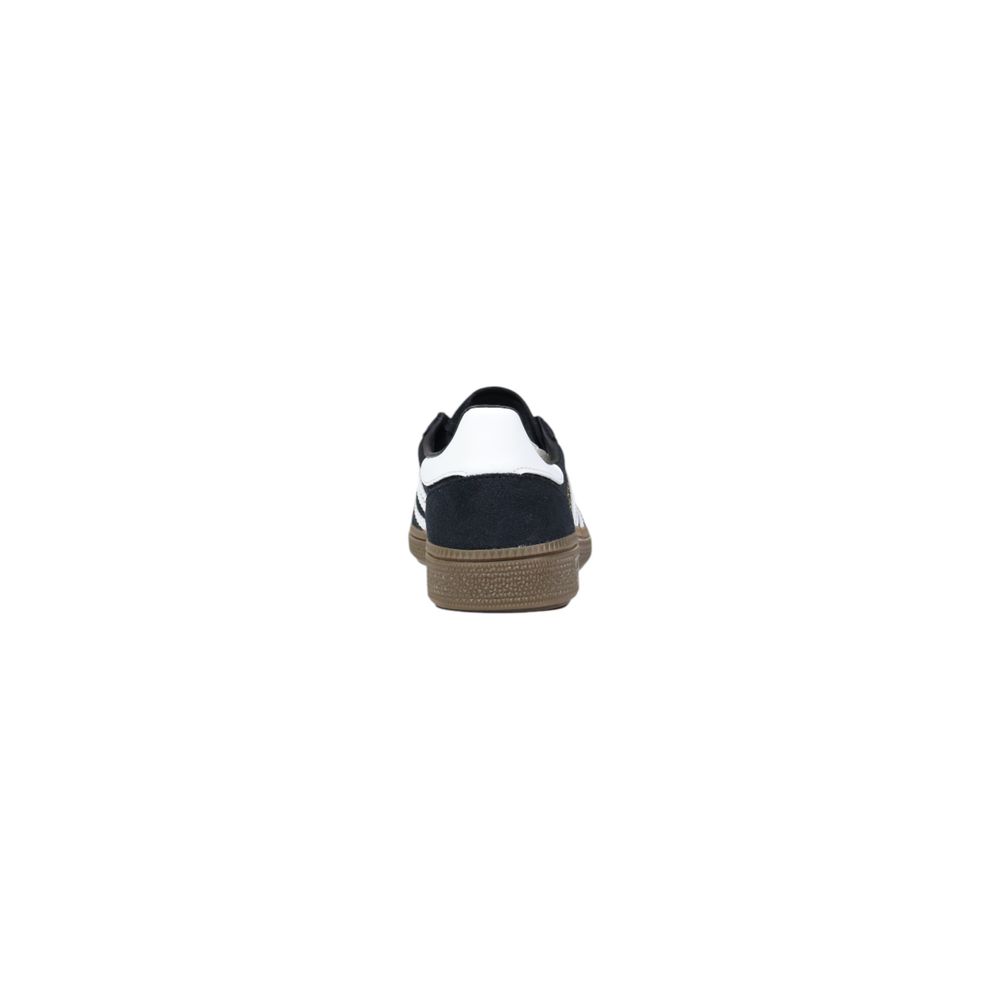 Adidas Originals black suede low-top sneaker with a white heel tab and a gum rubber sole, viewed from the back.