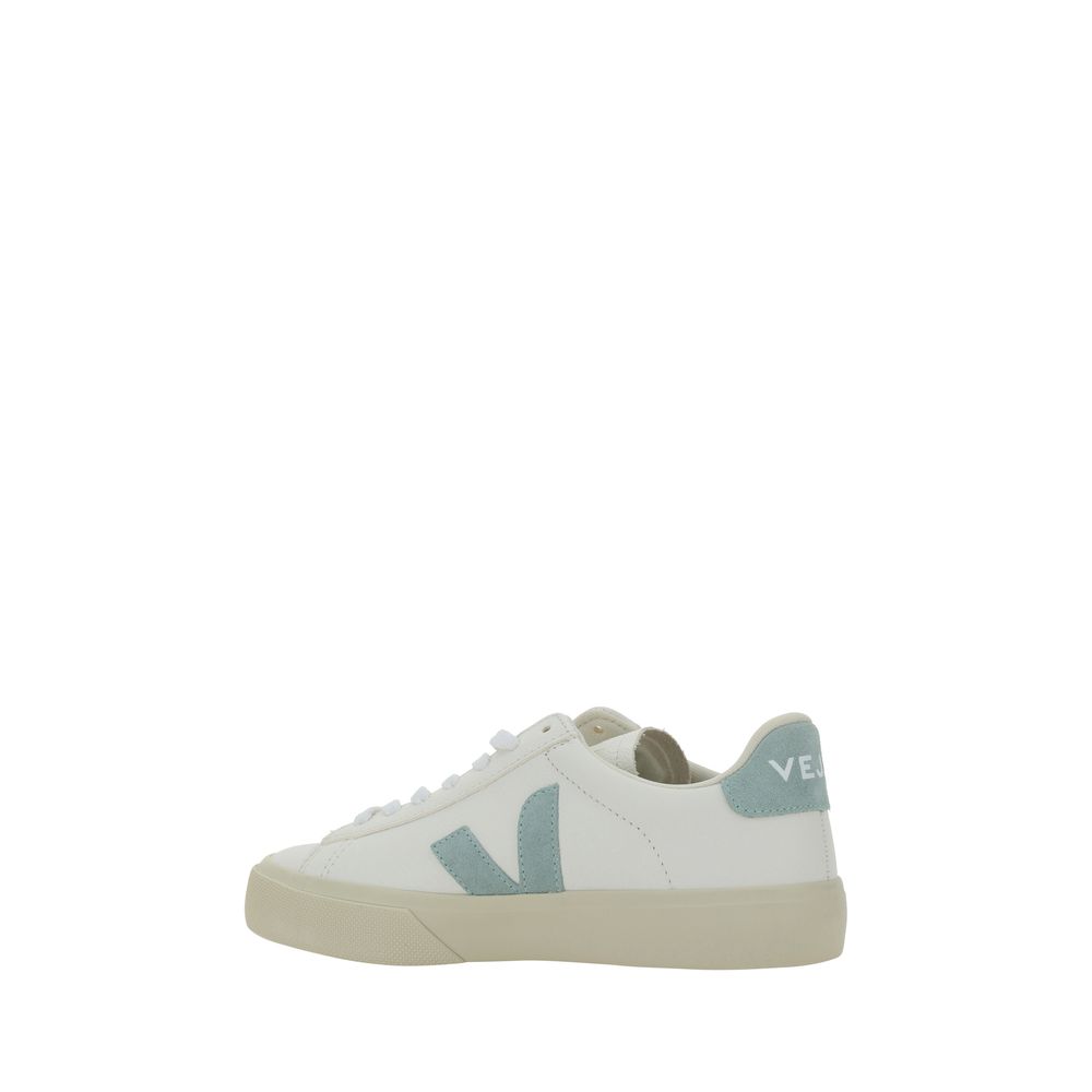 White calf leather Veja sneaker with light blue suede V logo and heel tab, plus a textured beige rubber sole.