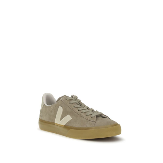 Beige sneaker with a white logo on a white background