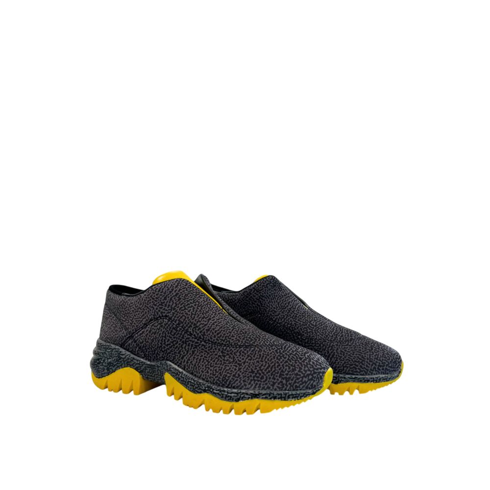 Borbonese women’s slip-on sneaker in textured black and grey patterned leather with a bright yellow jagged rubber sole.