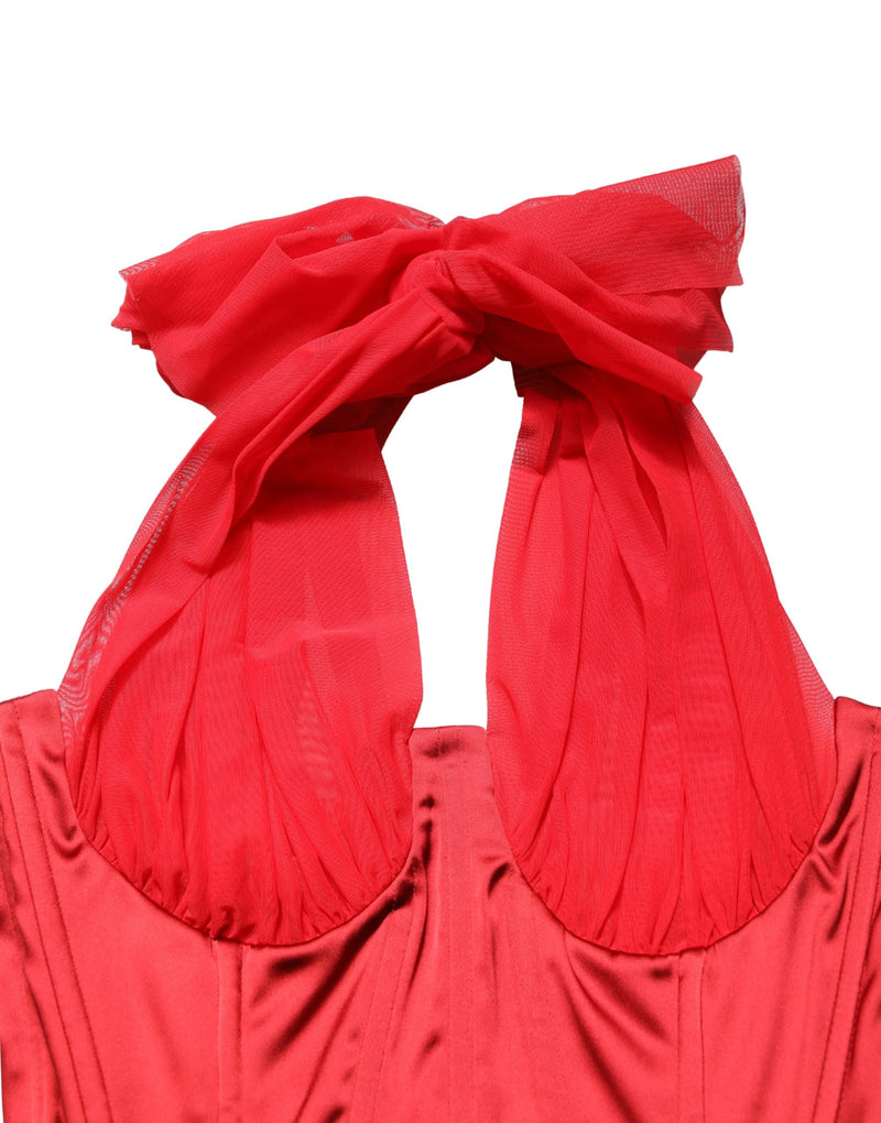 Red satin corset bodice with sheer halter tulle straps and bow tied at the neck