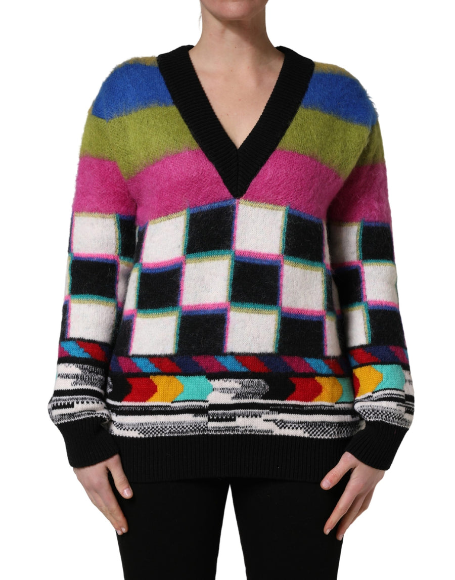 Fuzzy multicolored v-neck sweater with stripes, checkerboard pattern, and black ribbed trim