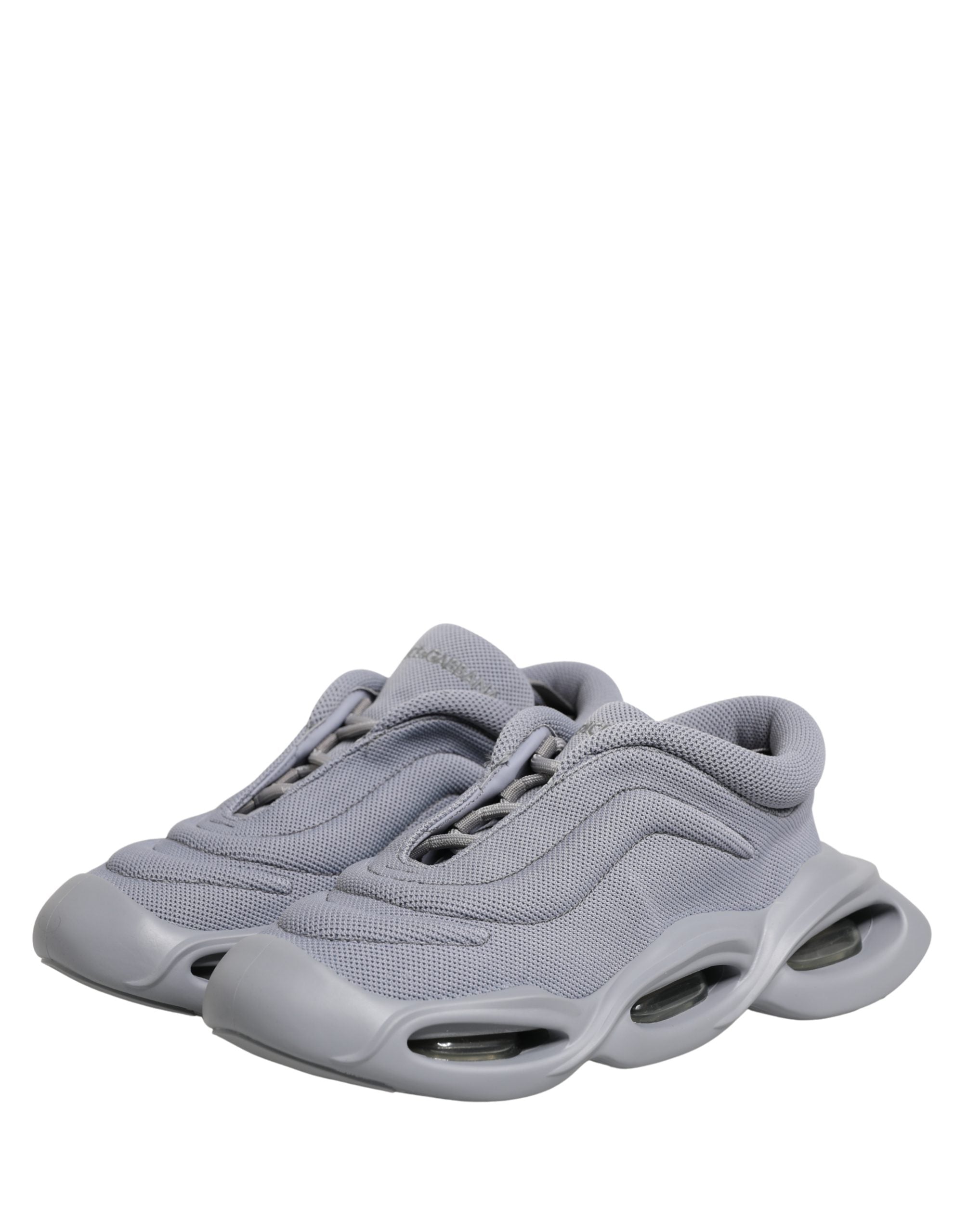 Dolce & Gabbana gray mesh slip-on low-top sneakers with a chunky, futuristic sculpted rubber sole.