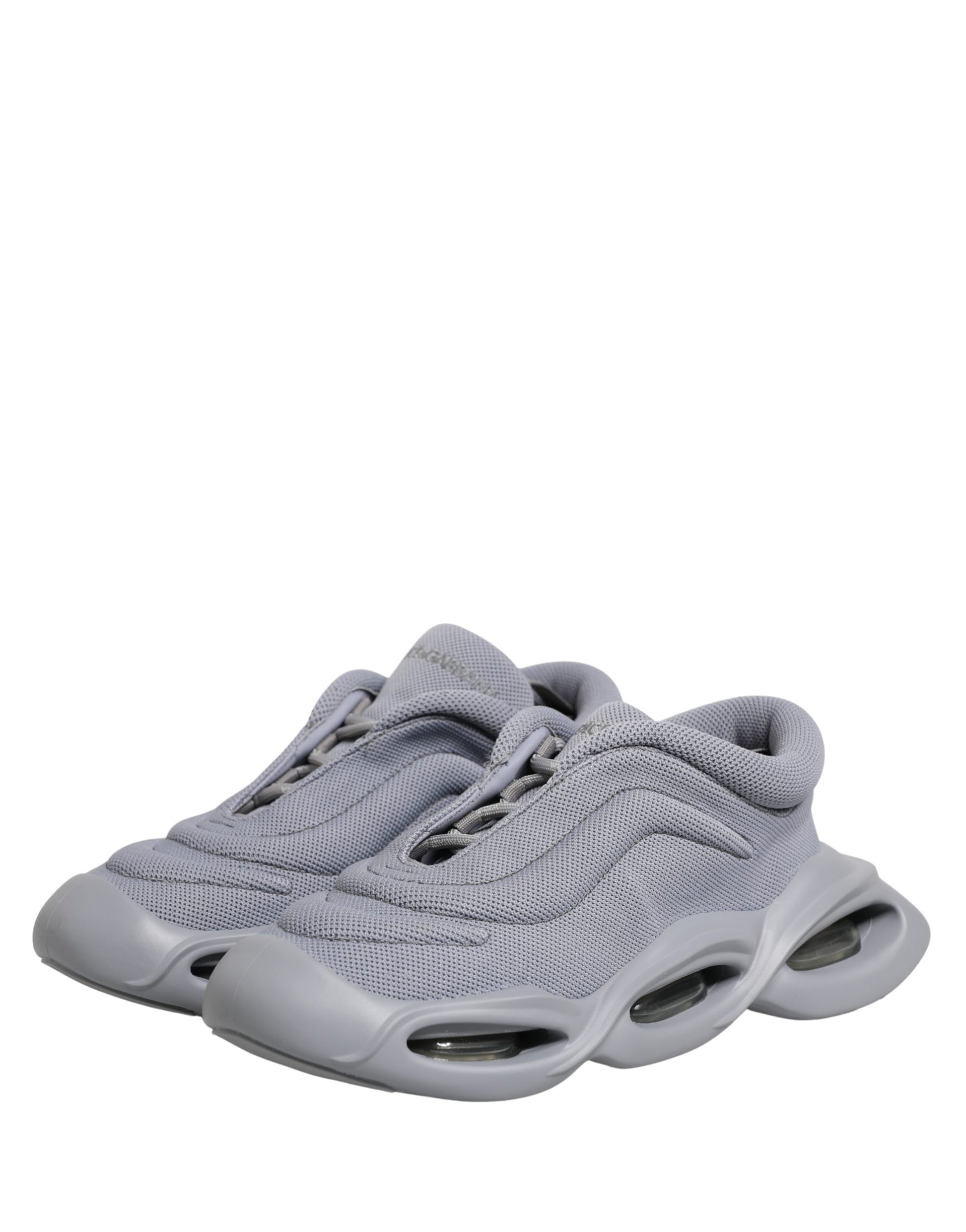 Dolce & Gabbana gray mesh slip-on low-top sneakers with a chunky, futuristic sculpted rubber sole.