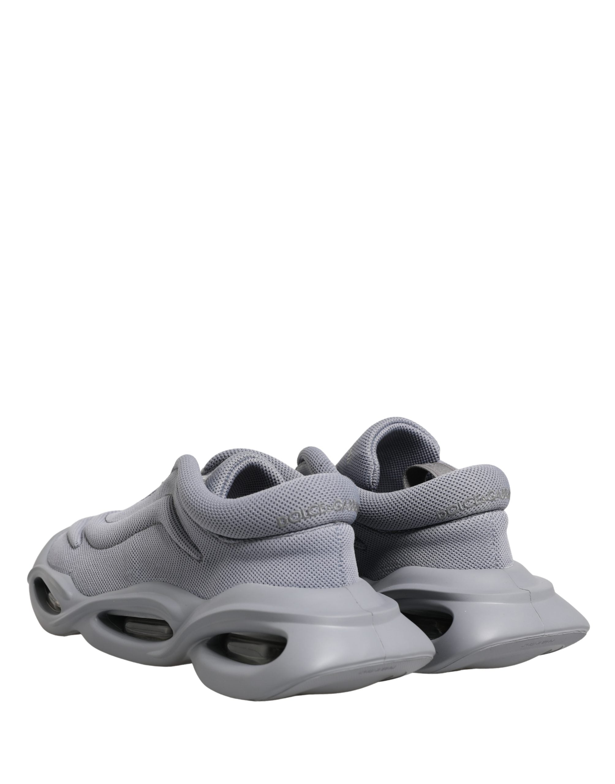 Dolce & Gabbana gray slip-on low-top sneakers in textured mesh with a chunky, architectural rubber wave sole.