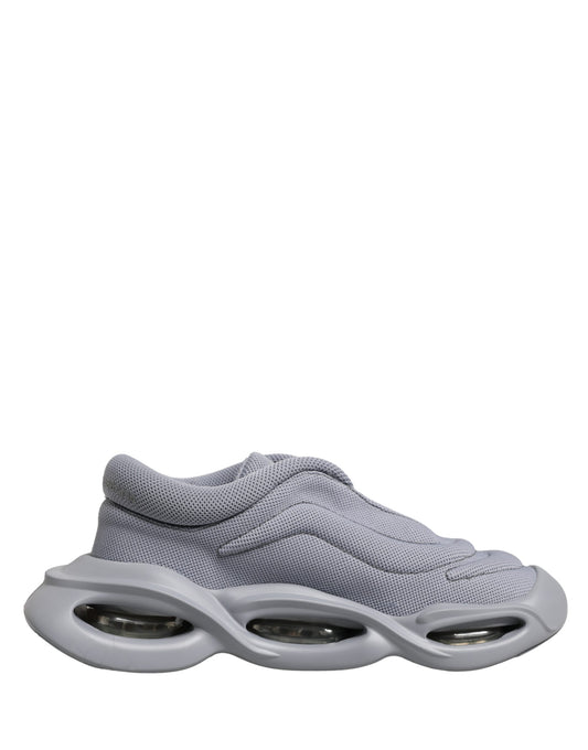 Dolce & Gabbana gray slip-on low-top sneakers in a textured knit fabric with a sculptural, futuristic cutout sole.