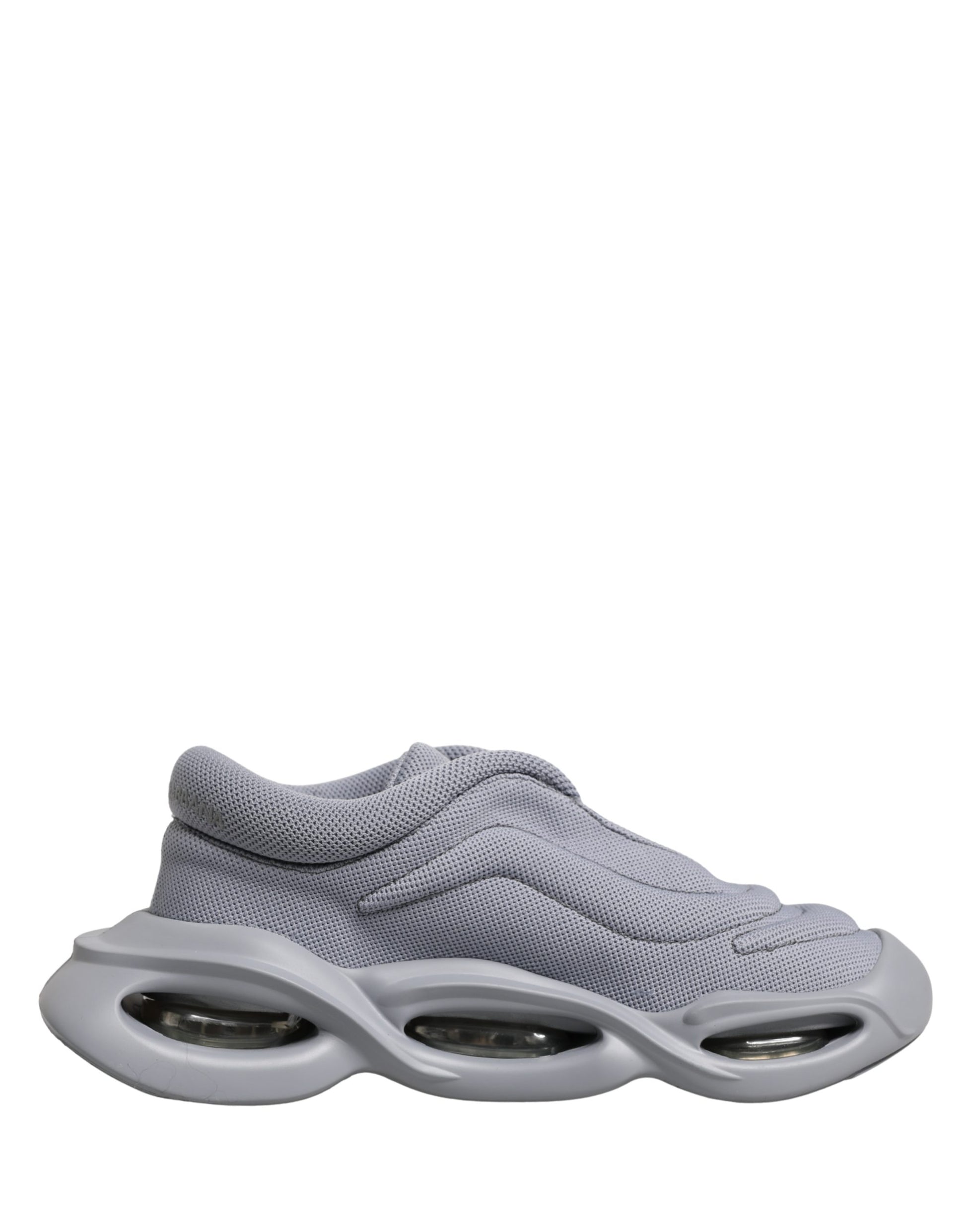 Dolce & Gabbana gray knit low-top slip-on sneaker with a sculptural, chunky wave-style rubber sole.