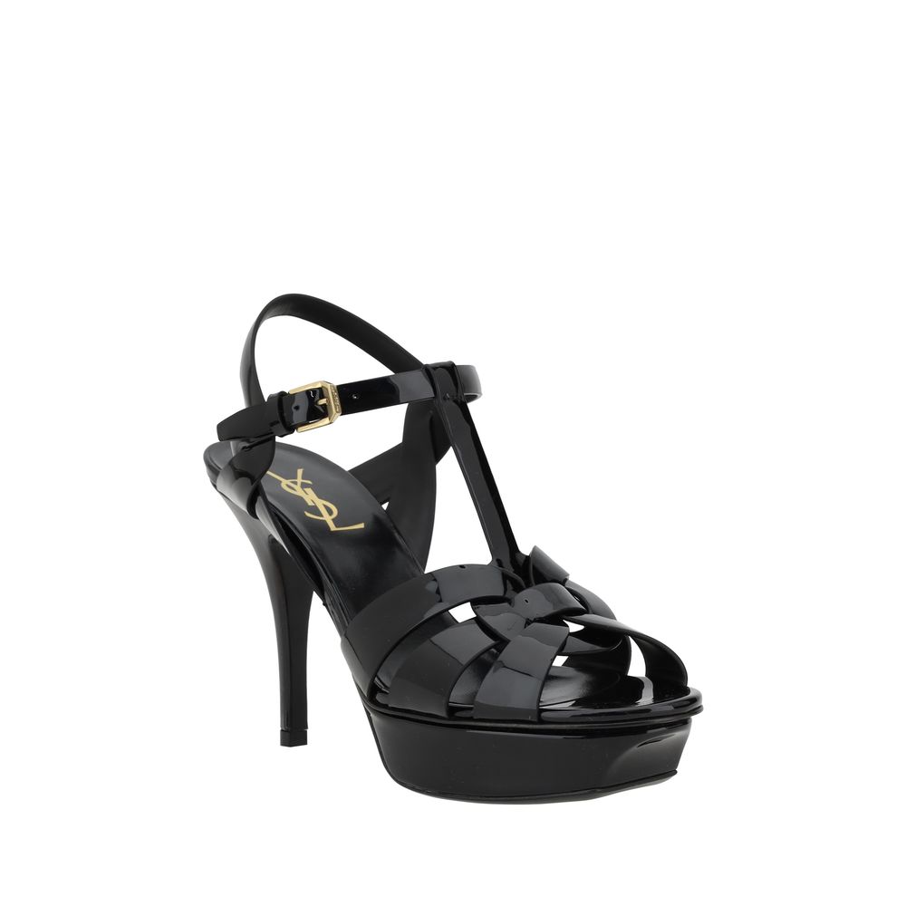 Black high-heeled sandal with platform on a white background