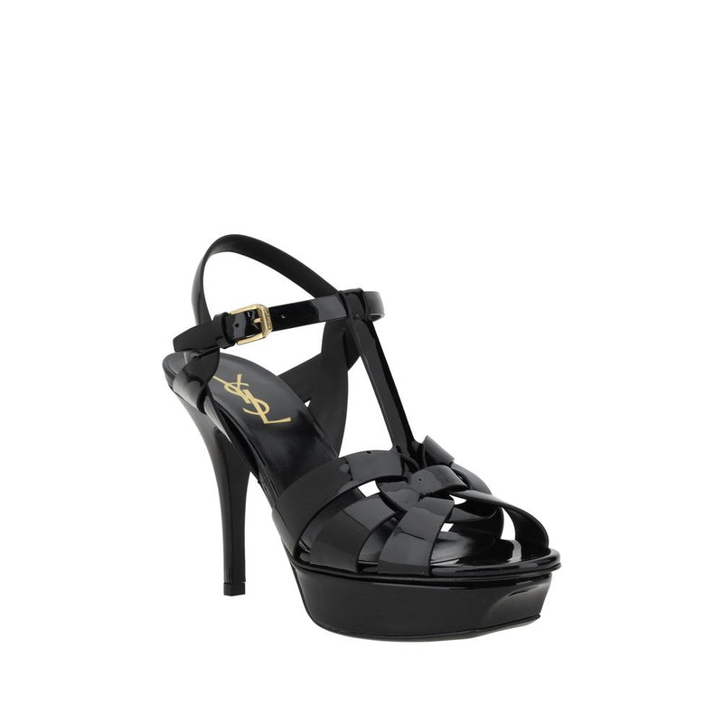 Black high-heeled sandal with platform on a white background