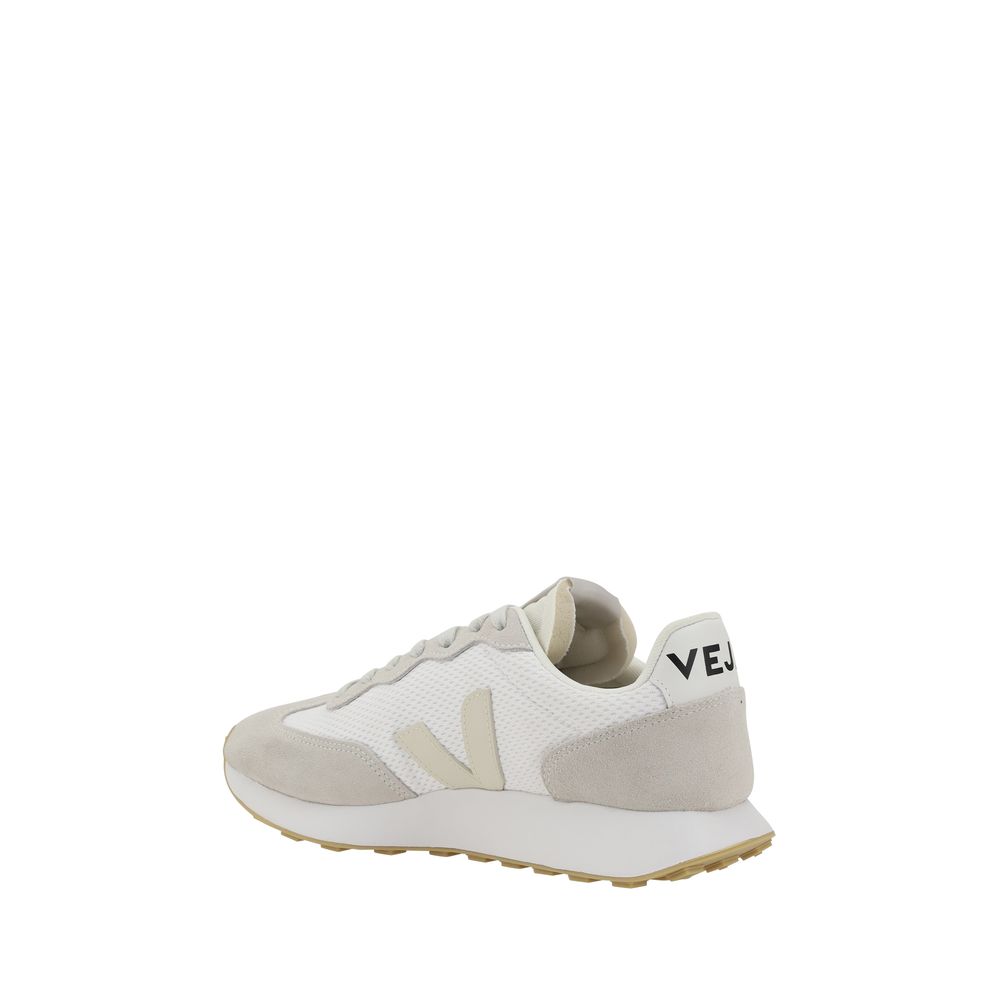Veja white mesh and suede sneaker with a beige V logo, white midsole, and tan tread, viewed from the side.
