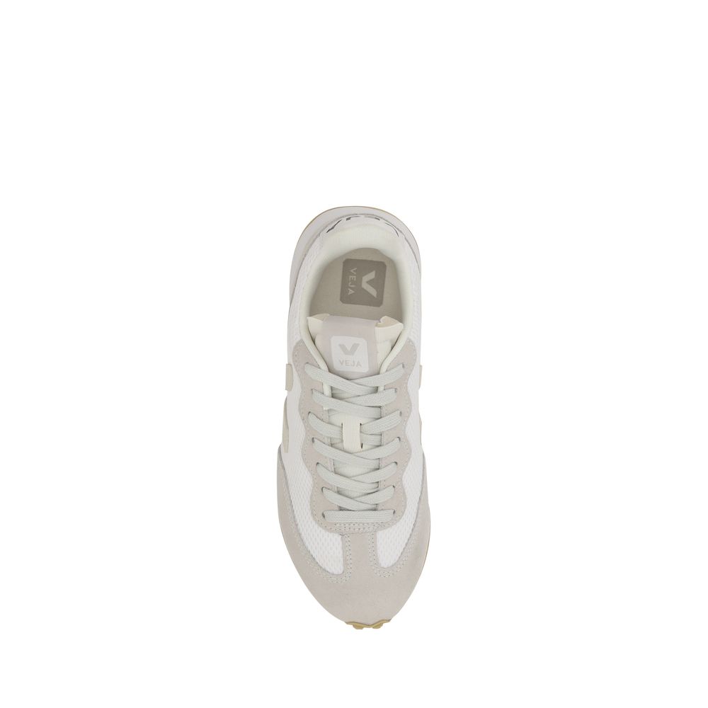 Top-down view of a white and light grey Veja sneaker with mesh panels, lace-up closure, and logo-branded tongue.