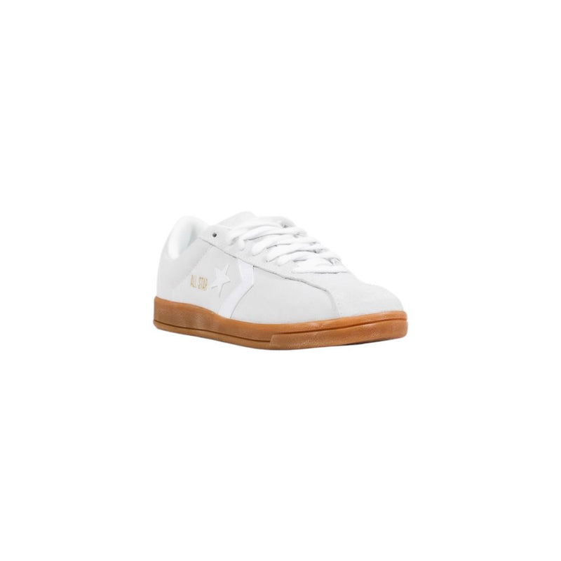 Converse white leather low top sneaker with a gum sole and star chevron logo