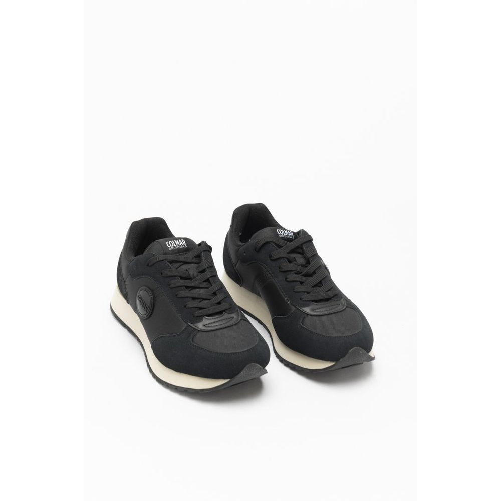 Black sneakers with white soles on a white background