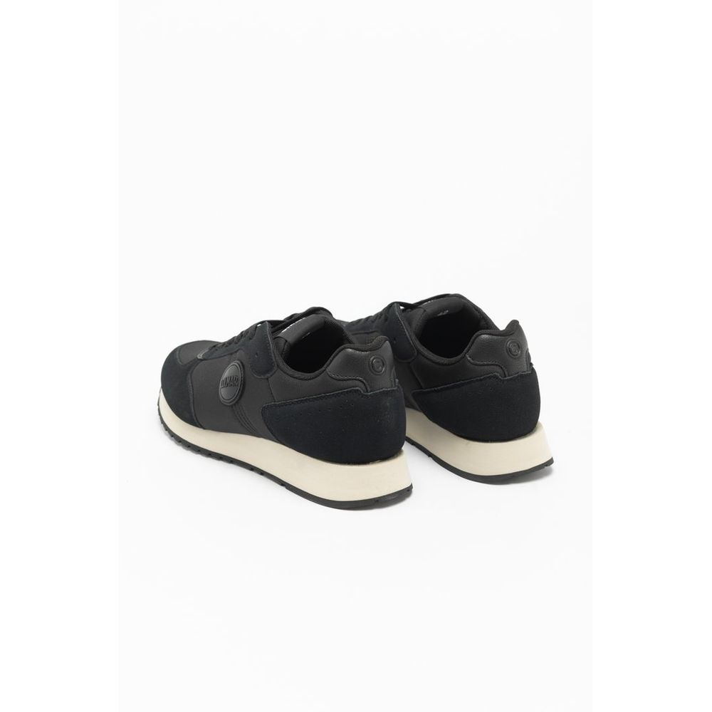 Black sneakers with white soles on a white background