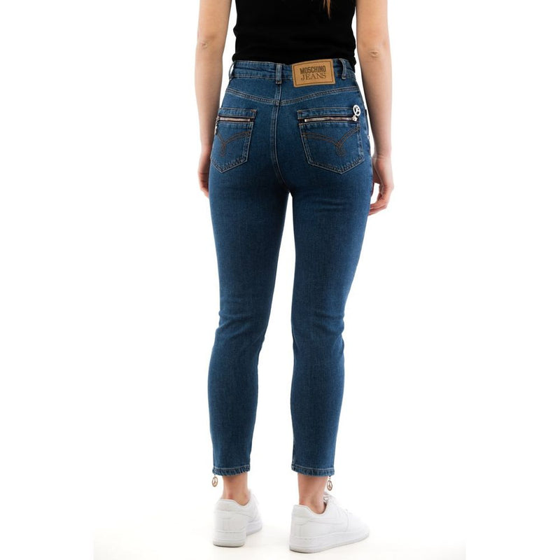 Blue cotton high-waisted skinny jeans with zippered back pockets worn from the back