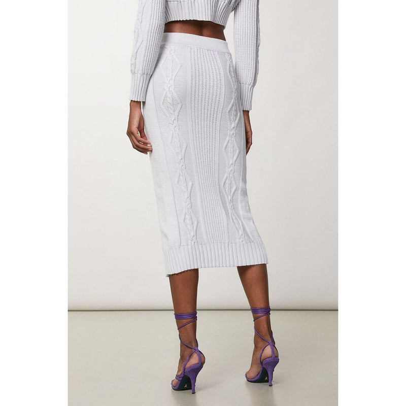 White knit viscose midi skirt with cable-knit pattern worn from the back