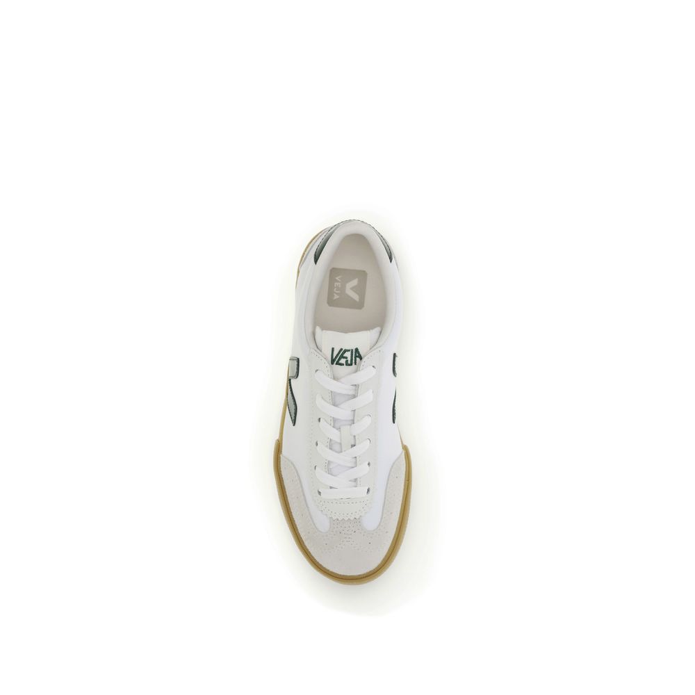 Veja white calf leather low-top sneakers with suede toe overlay, green V logo, and gum rubber sole. Top-down view.