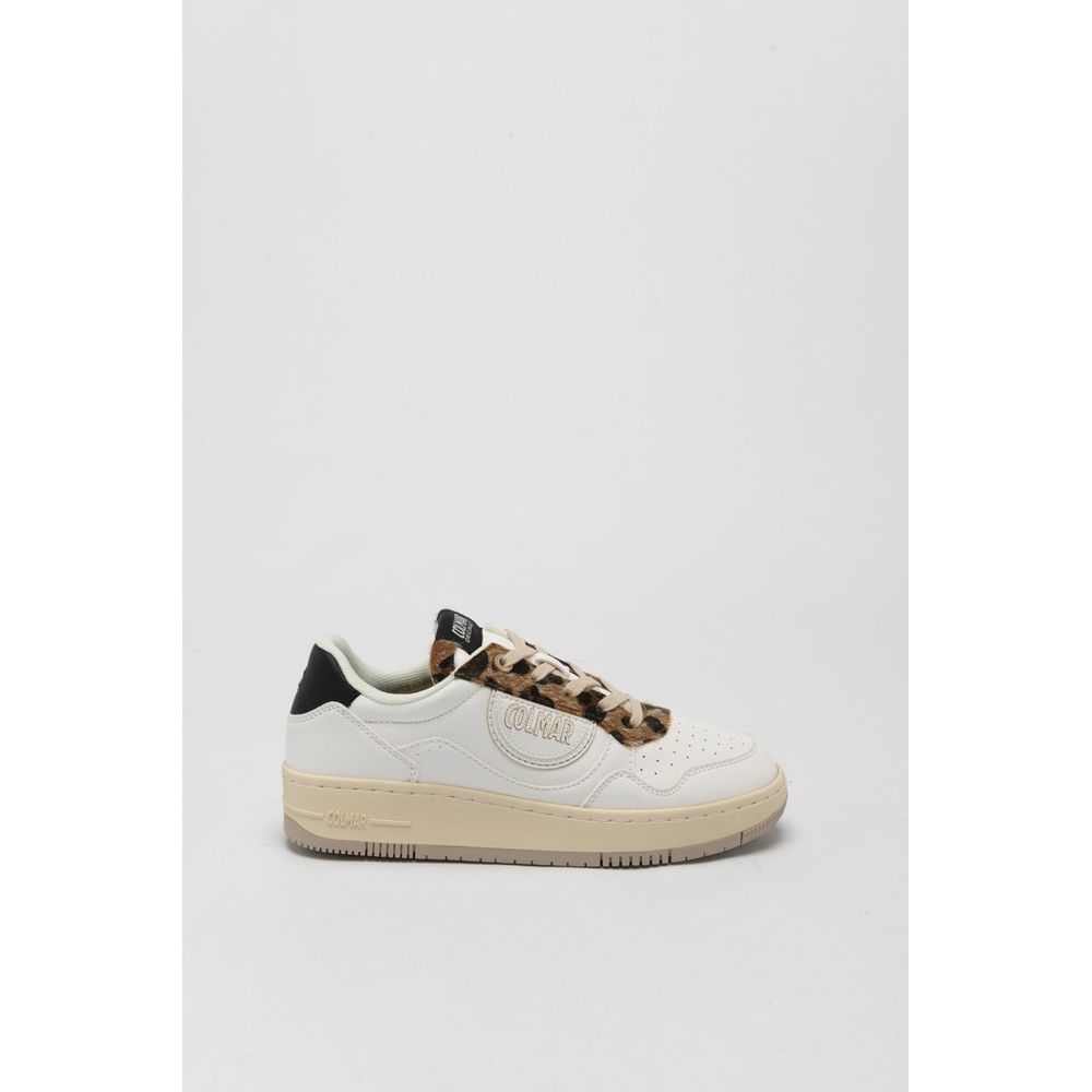White sneaker with leopard print accents on a gray background