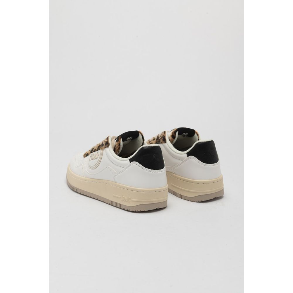 White sneakers with black accents on a light gray background