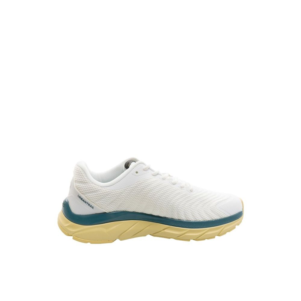 Female model wearing Colmar bicolor polyester athletic sneakers with a bold two-tone upper, sporty athletic silhouette, and lightweight performance construction, captured mid-step in a casual lifestyle pose showcasing the sneaker's dynamic color contrast and active sport style.